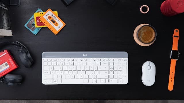 Logitech MK470 Slim Wireless Keyboard and Mouse Combo - Modern Compact Layout, Ultra Quiet, 2.4 GHz USB Receiver, Plug n' Play Connectivity, Compatible with Windows - Off White